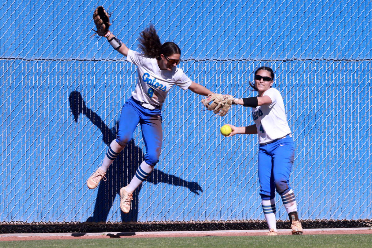 Green Valley’s Green Valley Lyla Baxter (9) celebrates a catch by Kalina Carrizales (4) ...