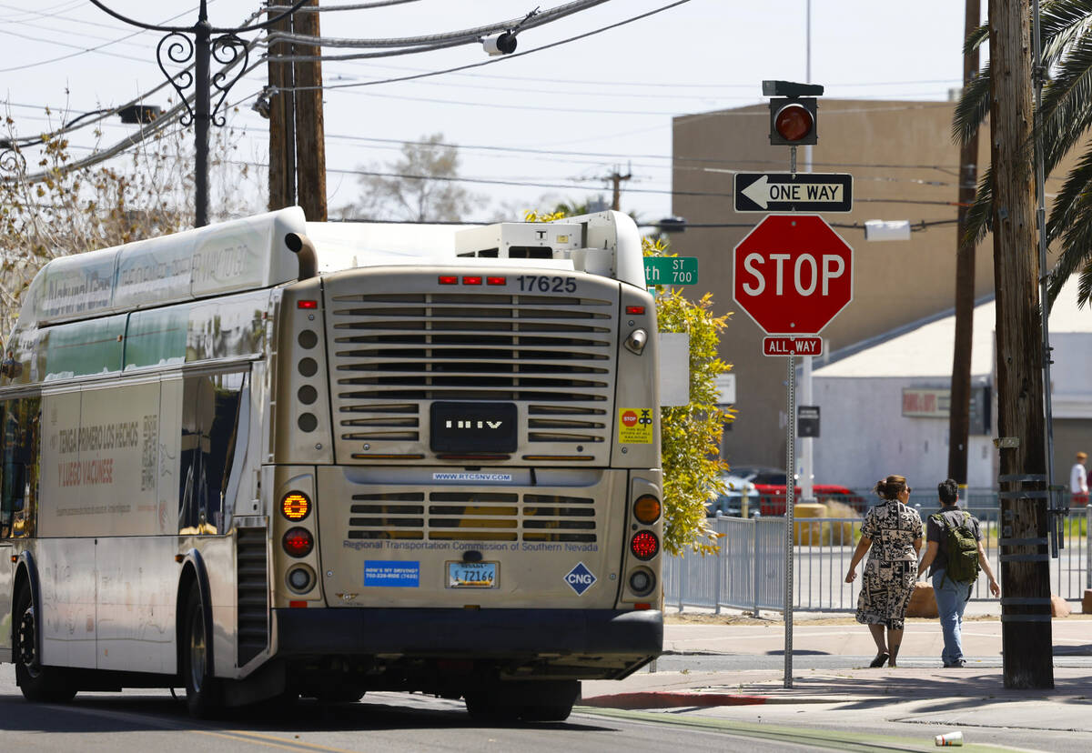 Pedestrians cross Fourth street where street signals recently added at the intersections of Gar ...