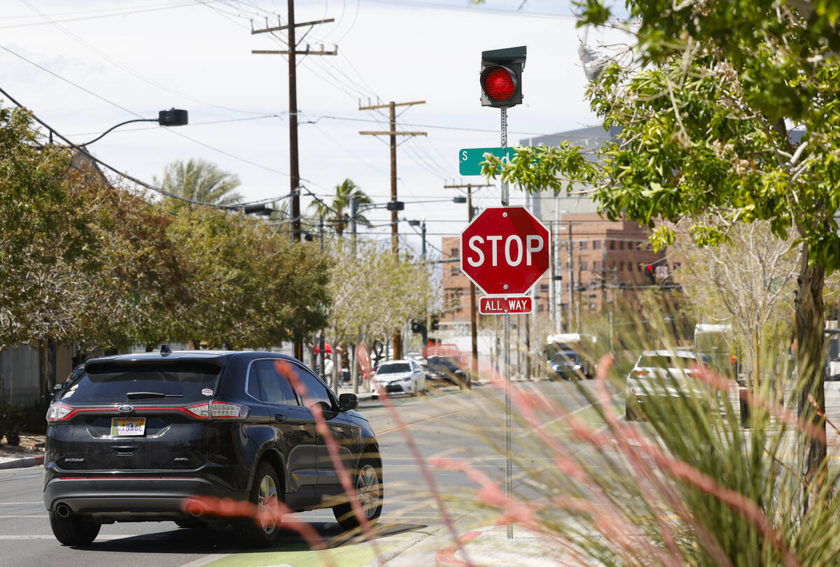 A motorist stops at Graces avenue where street signals recently added at the intersections of T ...