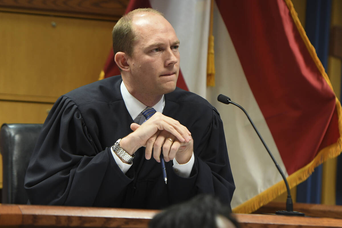 Judge Scott McAfee addresses the lawyers during a hearing on charges against former President D ...
