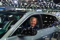 President Joe Biden drives a Cadillac Lyriq through the show room during a tour at the Detroit ...
