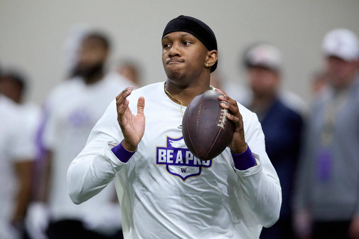 Washington quarterback Michael Penix Jr. looks to throw during the team's NFL football pro day ...