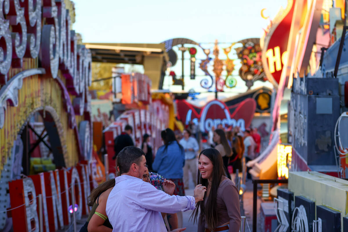 Visitors to the Neon Museum enjoy the Las Vegas history on Wednesday, April 3, 2024, in Las Veg ...