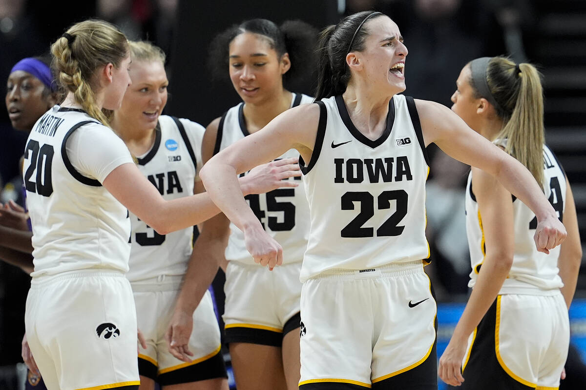 Iowa guard Caitlin Clark (22) reacts during the fourth quarter of an Elite Eight round college ...