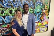 Courtney Kaplan, left, volunteer, and Tyre Gray, right, chief administrative officer of the Nev ...