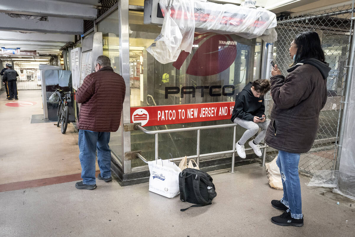 People wait at the 8th and Market PATCO station because of a suspension of service on PATCO, so ...