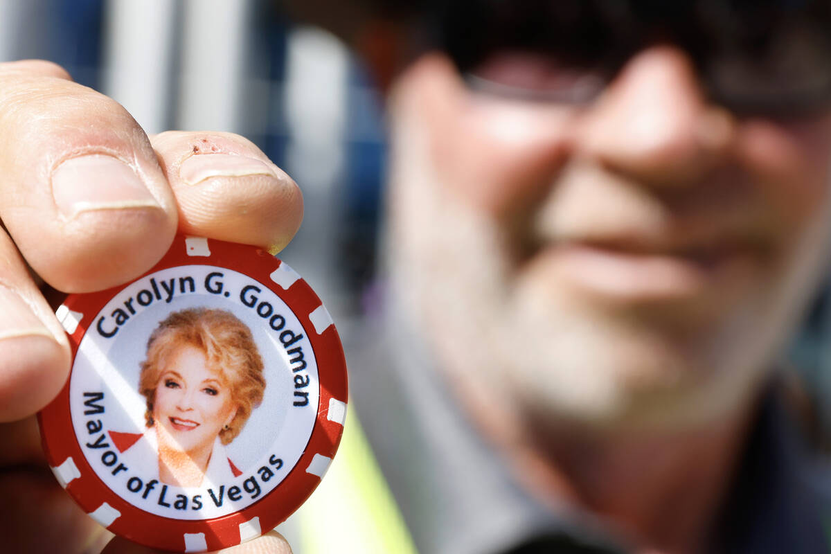 Matt Colman, senior superintendent at CORE construction, displays one of Mayor Carolyn Goodman' ...