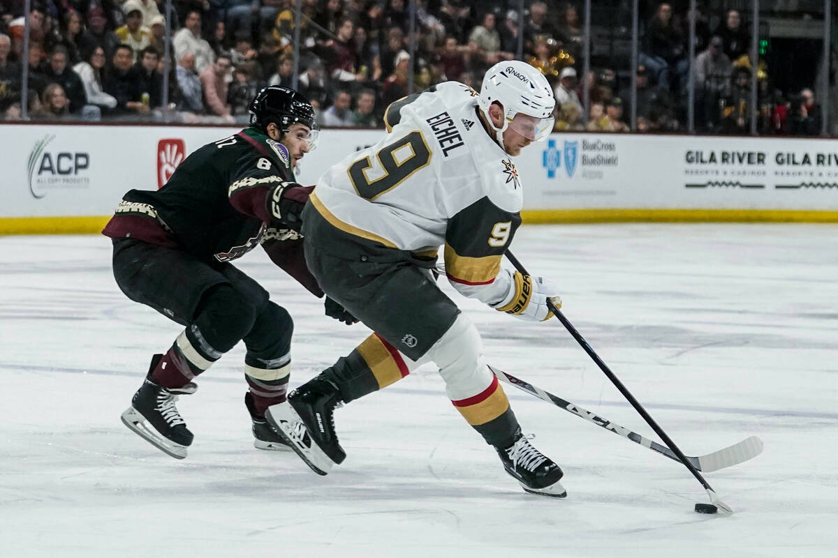 Vegas Golden Knights center Jack Eichel (9) controls the puck in front of Arizona Coyotes cente ...
