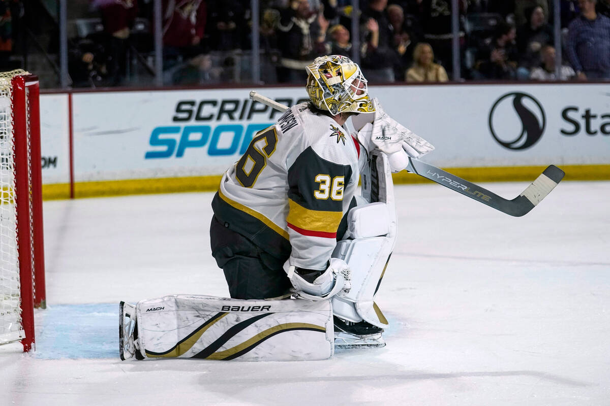 Vegas Golden Knights goaltender Logan Thompson looks up at the scoreboard after giving up three ...