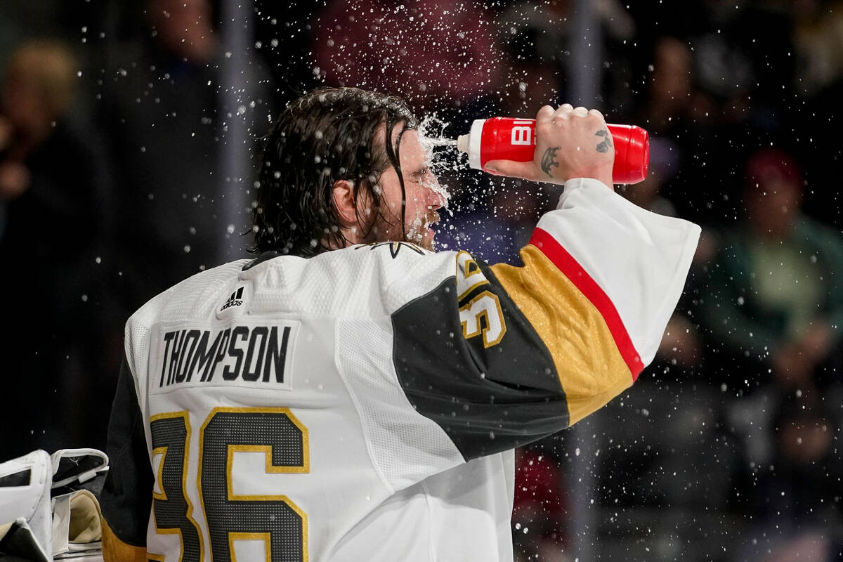 Vegas Golden Knights goaltender Logan Thompson (36) sprays himself with water during the third ...