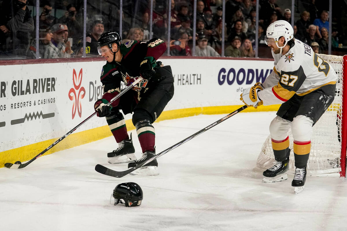 Arizona Coyotes center Nick Bjugstad (17) controls the puck in front of Vegas Golden Knights de ...