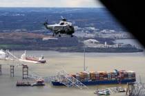 President Joe Biden, aboard Marine One, takes an aerial tour of the collapsed Francis Scott Key ...
