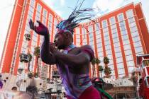 Artist Thomas Archey of "Mystère" by Cirque du Soleil dances at a pop up performance to commem ...