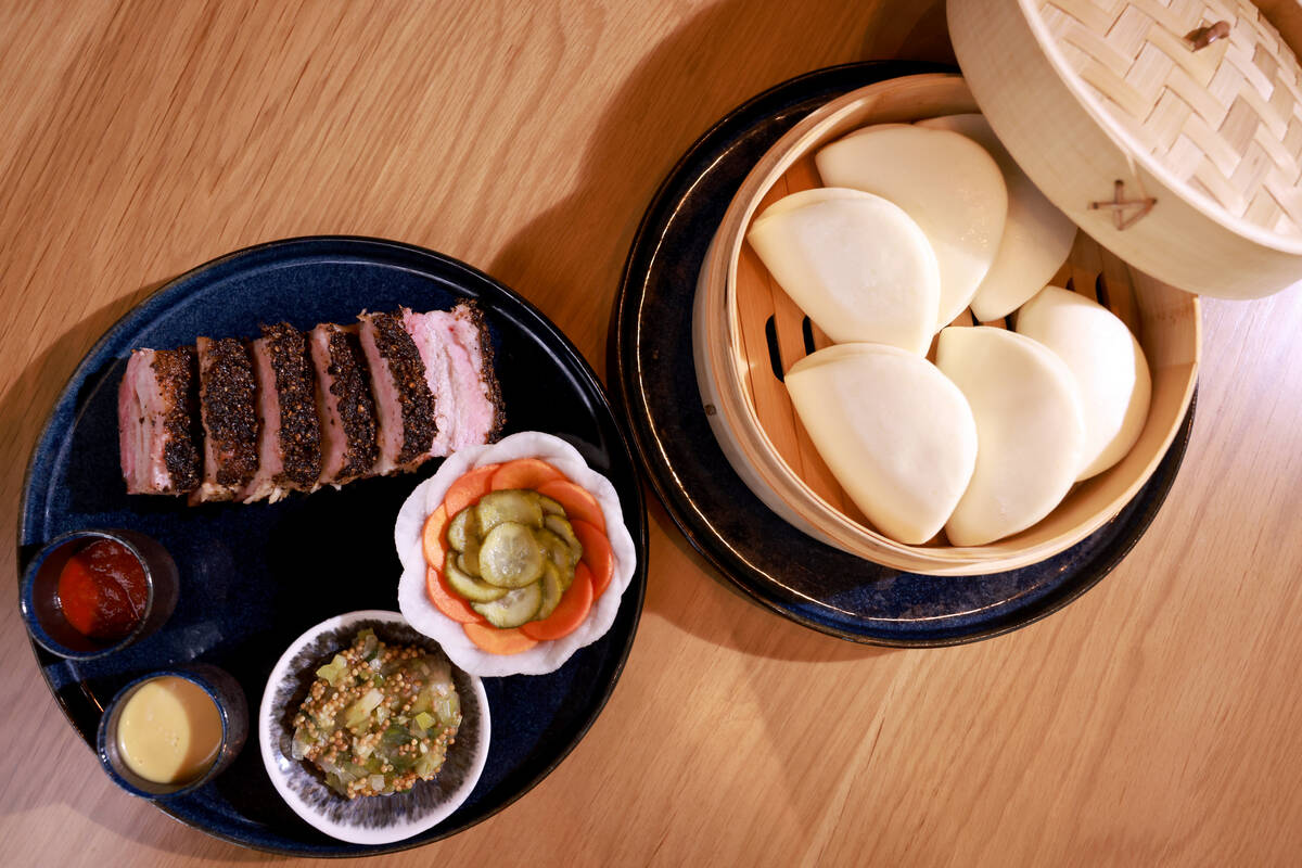 Pork belly pastrami, served with bao and miso mustard, at KYU, an American barbecue restaurant ...