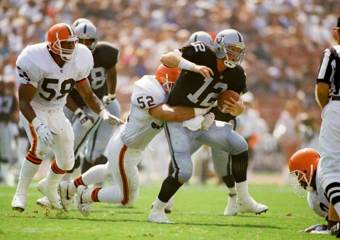 In this Sept. 20, 1992, file photo, Los Angeles Raiders starting guard quarterback Todd Marinov ...