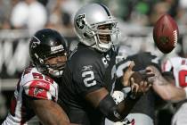 In this Nov. 2, 2008, file photo, Oakland Raiders quarterback JaMarcus Russell (2) fumbles the ...