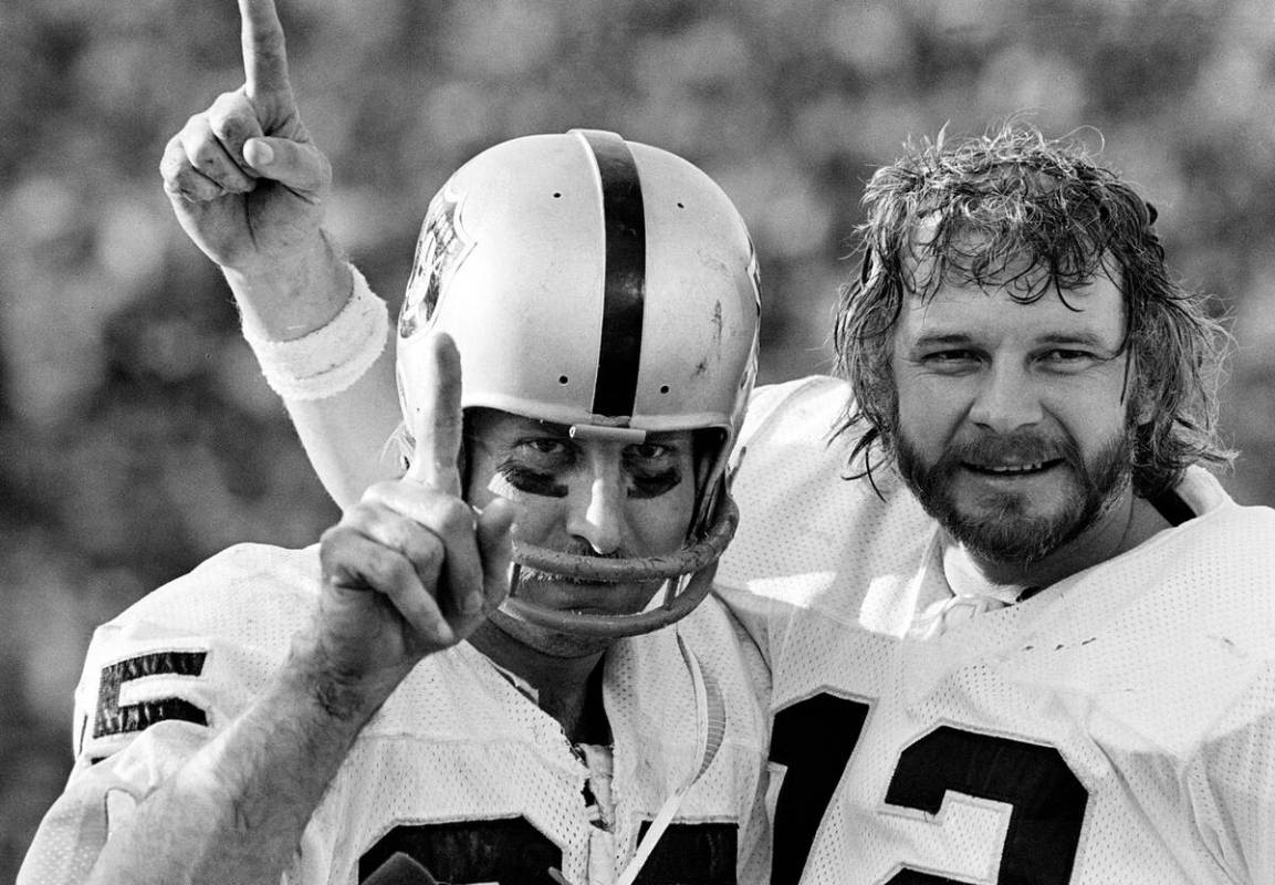 Oakland Raiders receiver Fred Biletnikoff, left, and quarterback Ken Stabler gesture after they ...