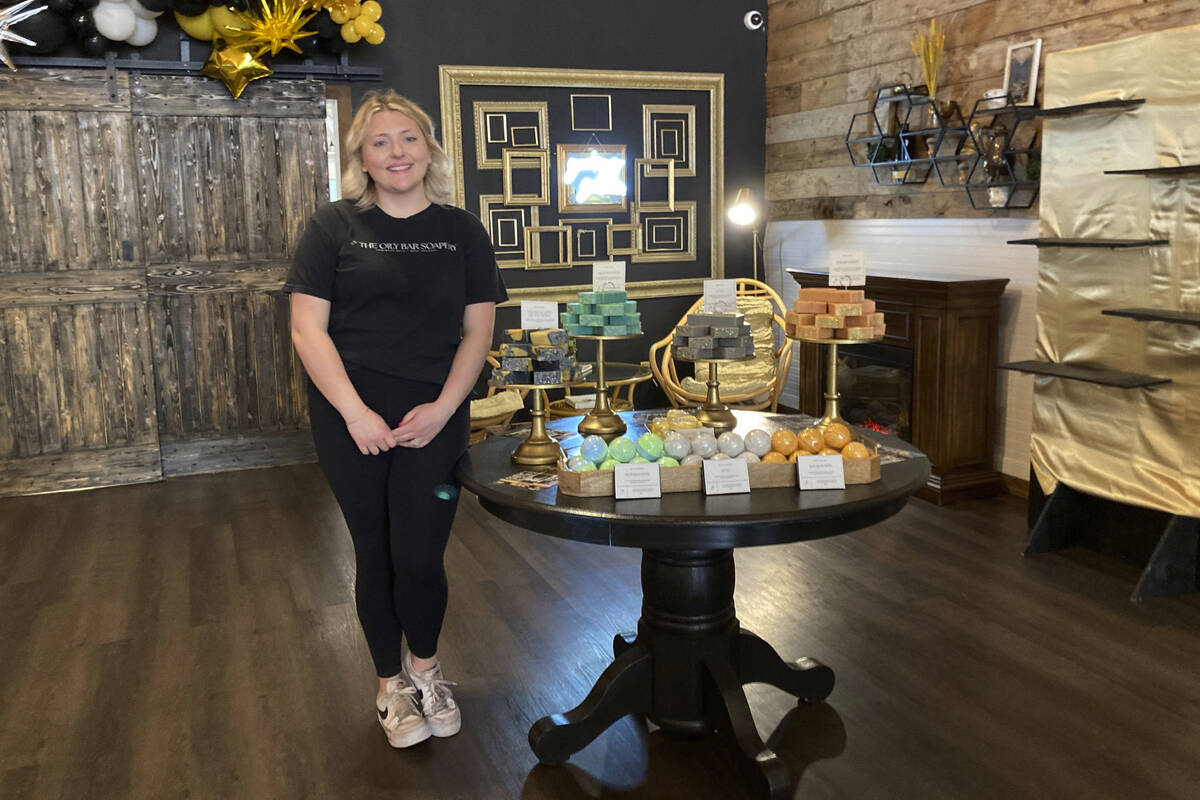 Kalee Hume stands alongside her handmade eclipse-themed soaps at her shop in downtown Waxahachi ...