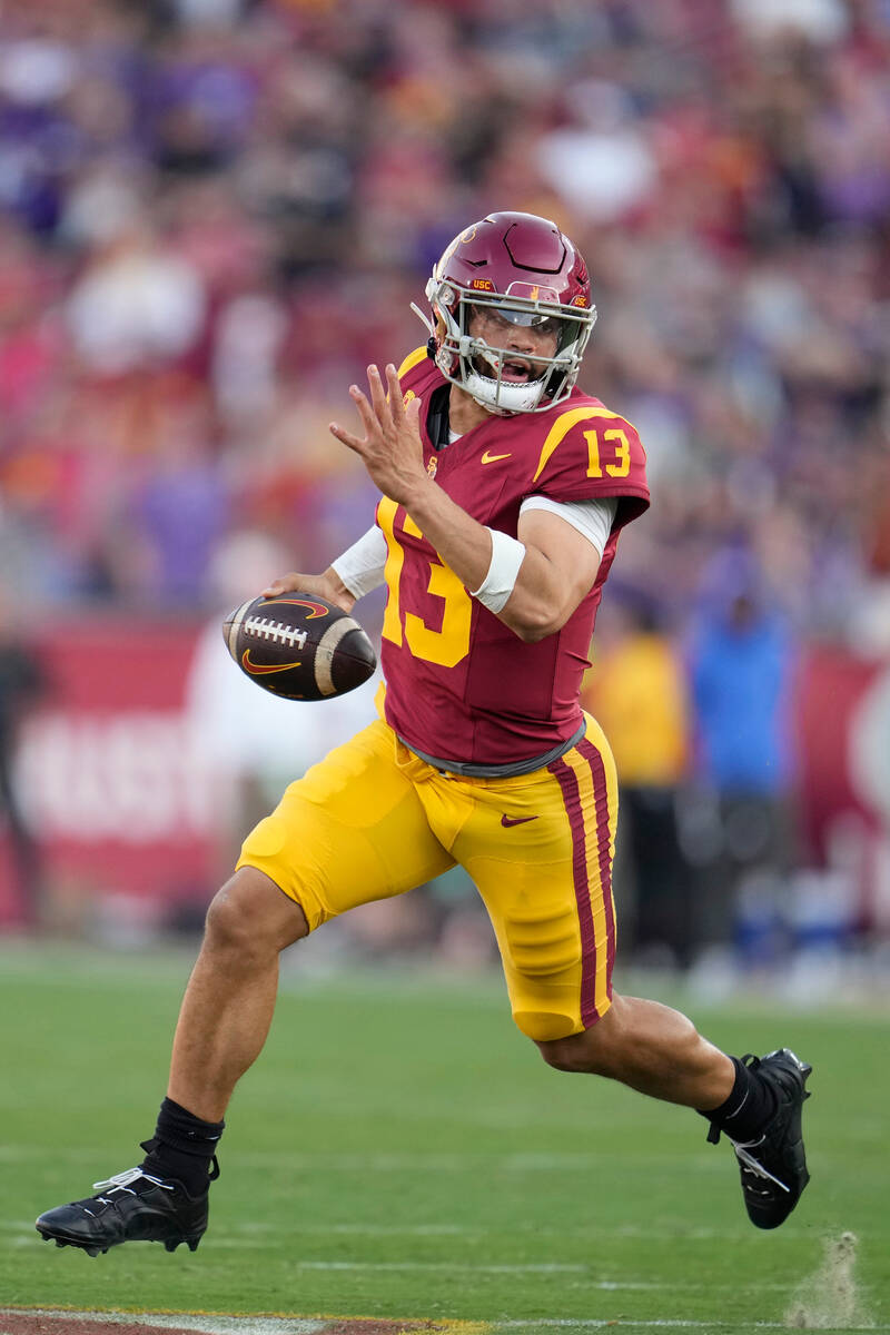 Southern California quarterback Caleb Williams (13) runs during the first half of an NCAA colle ...