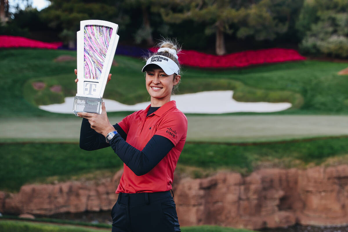 Nelly Korda poses with a trophy during the T-Mobile Match Play championship match at Shadow Cre ...