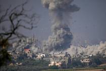 Smoke rises following an Israeli airstrike in the Gaza Strip, as seen from southern Israel, Mon ...