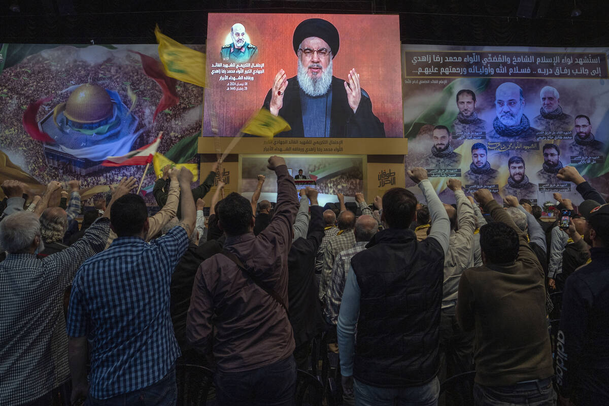 Hezbollah leader Sayyed Hassan Nasrallah speaks in a televised address via a video link during ...