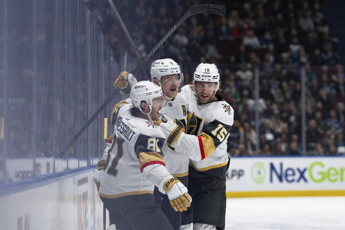 Vegas Golden Knights' Jonathan Marchessault (81), Jack Eichel (9) and Noah Hanifin (15) celebra ...