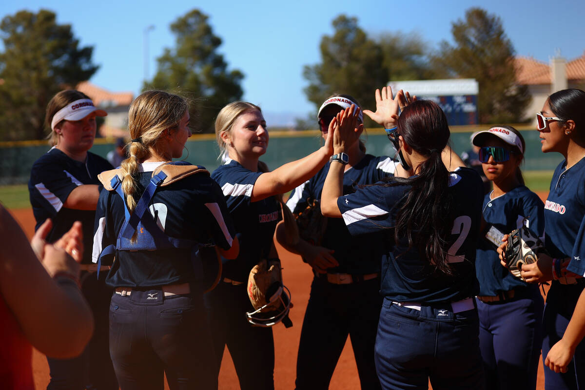 Coronado celebrates after a no-hit inning during a high school softball game against Liberty on ...