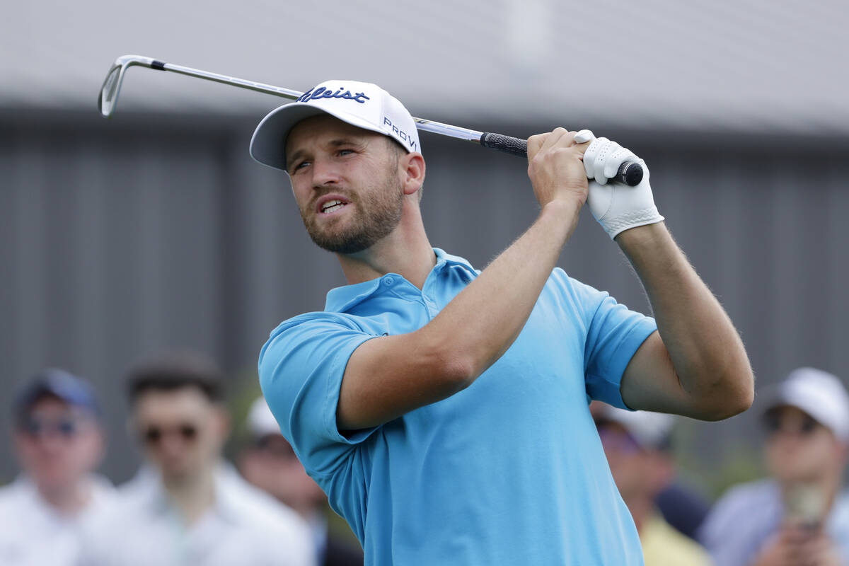Wyndham Clark watches his tee shot on the ninth hole during the first round of the Houston Open ...