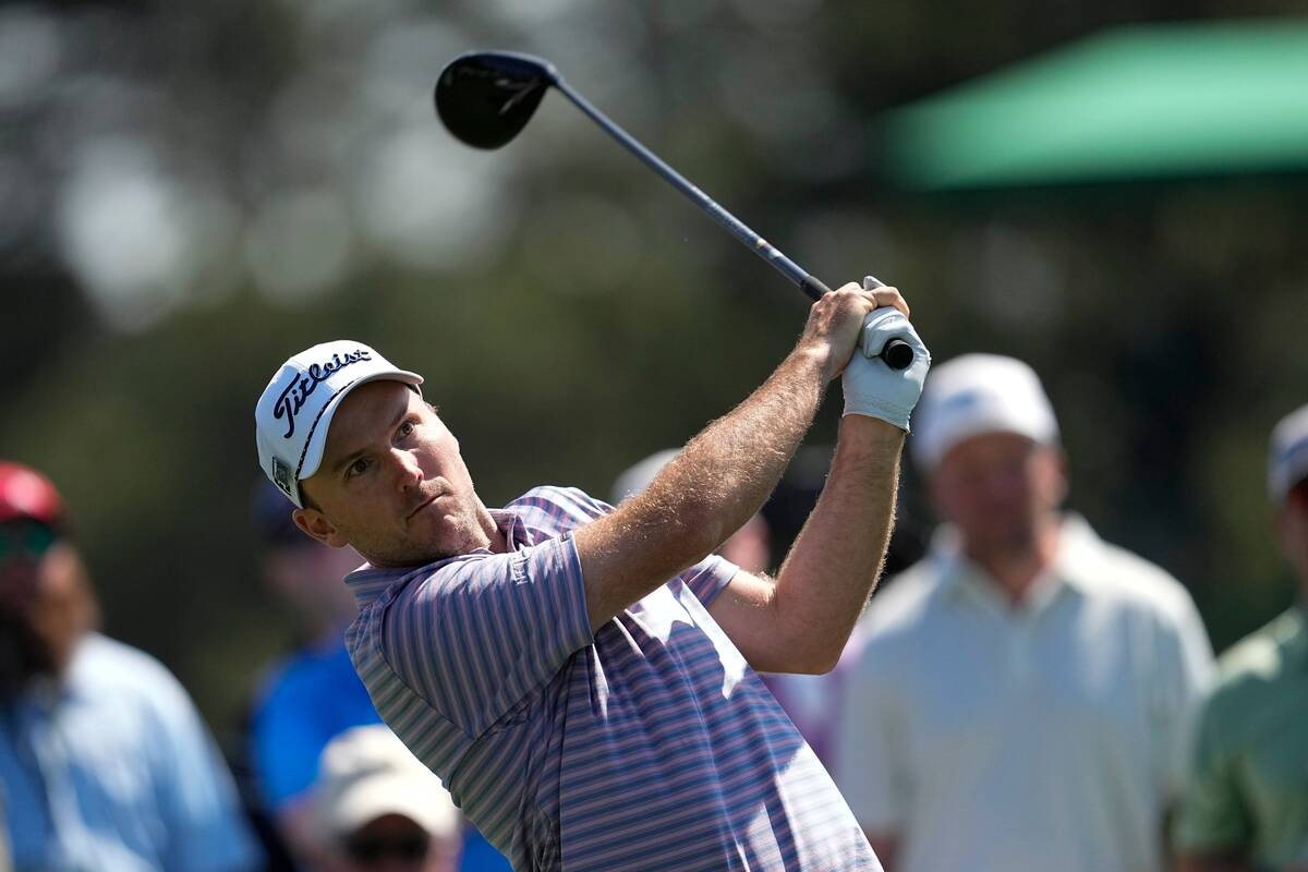Russell Henley watches his shot on the eighth hole during a practice round in preparation for t ...