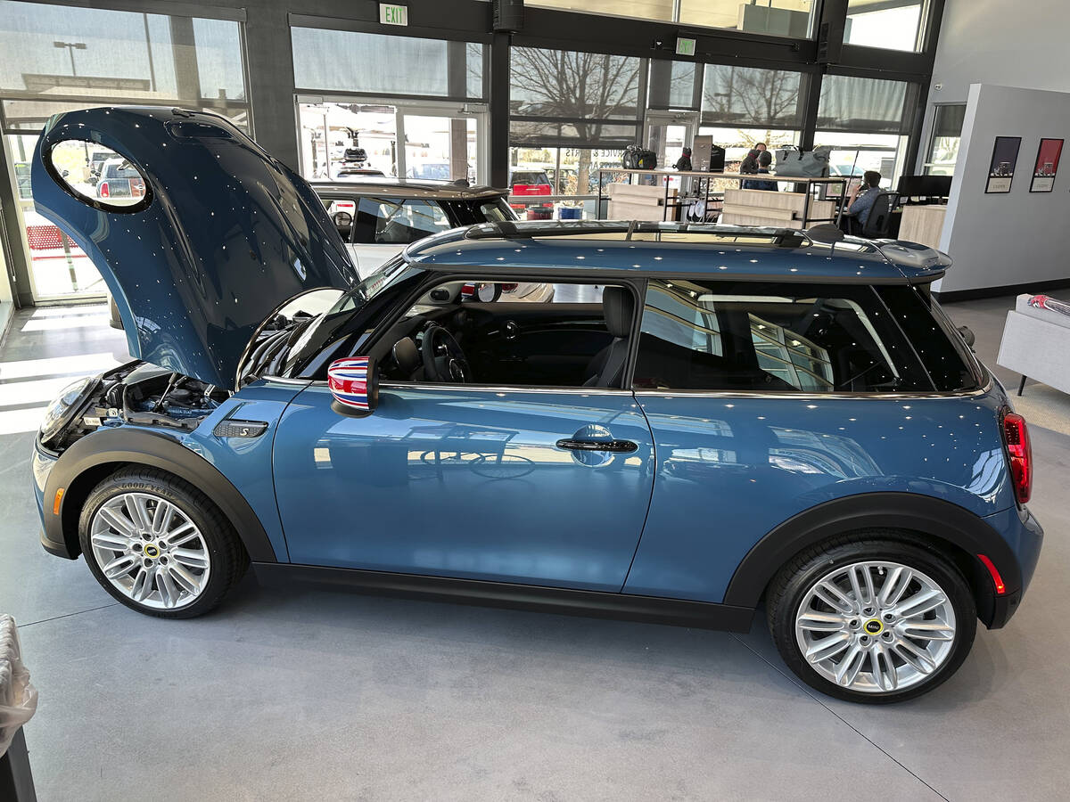 An unsold 2024 Cooper SE electric hardtop sits on the showroom floor of a Mini dealership Thurs ...