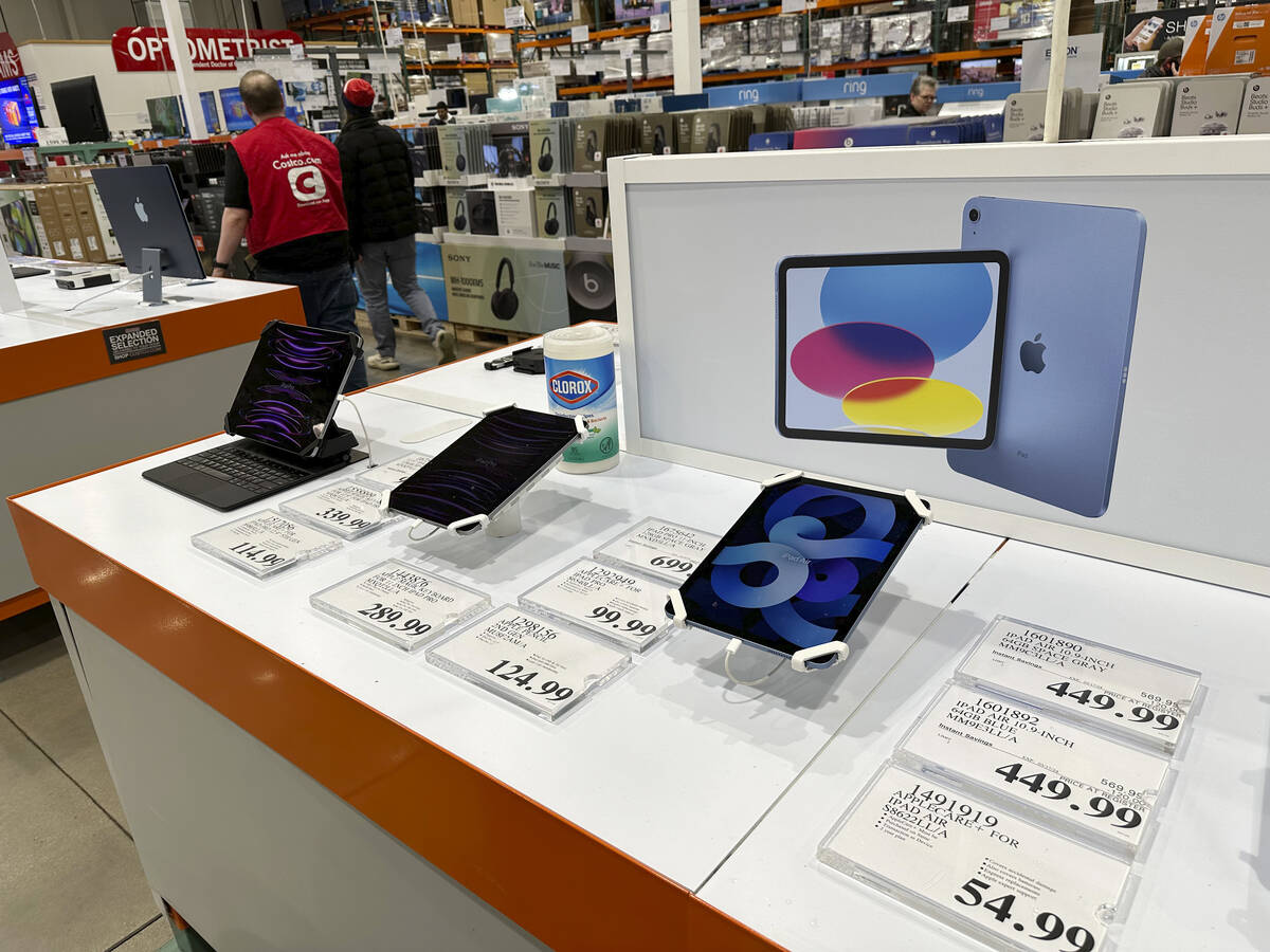 Apple iPads are displayed in a Costco warehouse Sunday, March 17, 2024, in Sheridan, Colo. On W ...