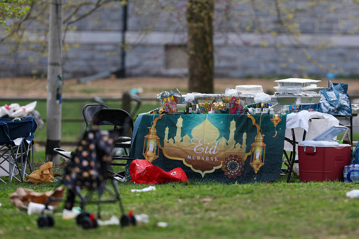 Food and belongings are left behind following a shooting at an Eid al-Fitr event, Wednesday, Ap ...