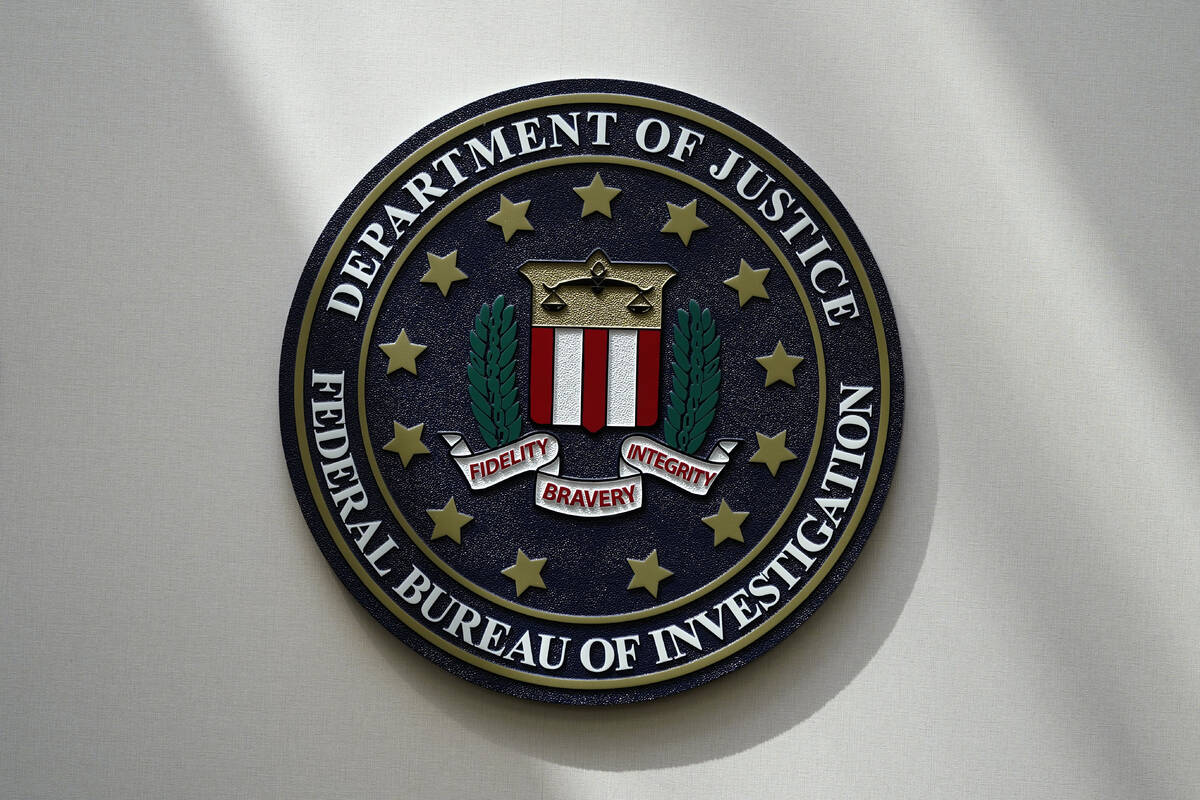 FILE - An FBI seal is seen on a wall on Aug. 10, 2022, in Omaha, Neb. The House was holding a k ...