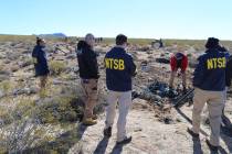 NTSB investigators survey the site of an Airbus Helicopters EC-130 on Sunday, Feb. 11, 2024, ne ...