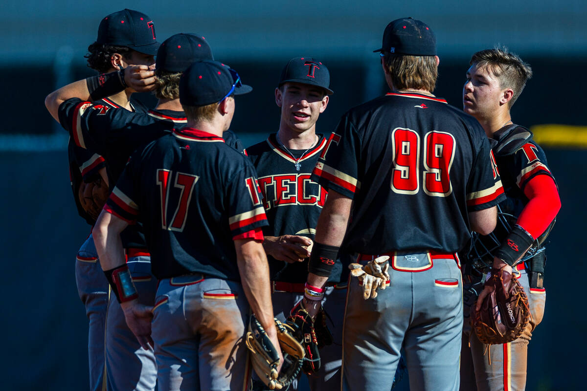 Tech pitcher Tiernon Wolf chats with teammates on the mound as Cheyenne has bases loaded during ...