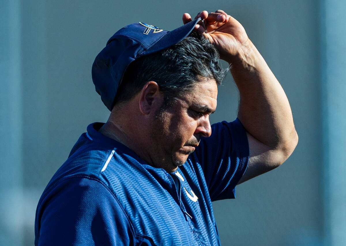 Cheyenne head coach Wade Schmidt is a bit dismayed as his team is down many runs to during the ...