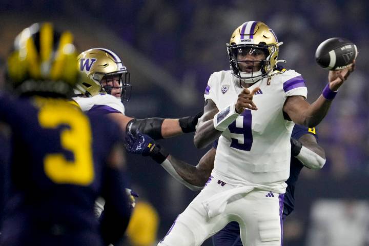 Washington quarterback Michael Penix Jr. passes against Michigan during the first half of the n ...