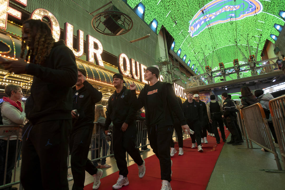 Florida players enter a welcome reception ahead of the Las Vegas Bowl NCAA football game agains ...