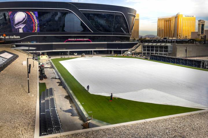 The field is worked on as Super Bowl preparations continue at Allegiant Stadium on Wednesday, J ...