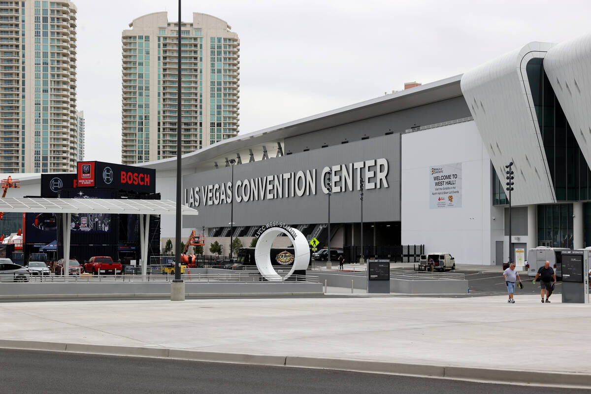 Workers prepare the West Hall of the Las Vegas Convention Center for the World of Concrete conv ...