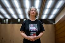 Former Hamas hostage Aviva Siegel poses with a t-shirt showing a picture of her husband, Keith ...