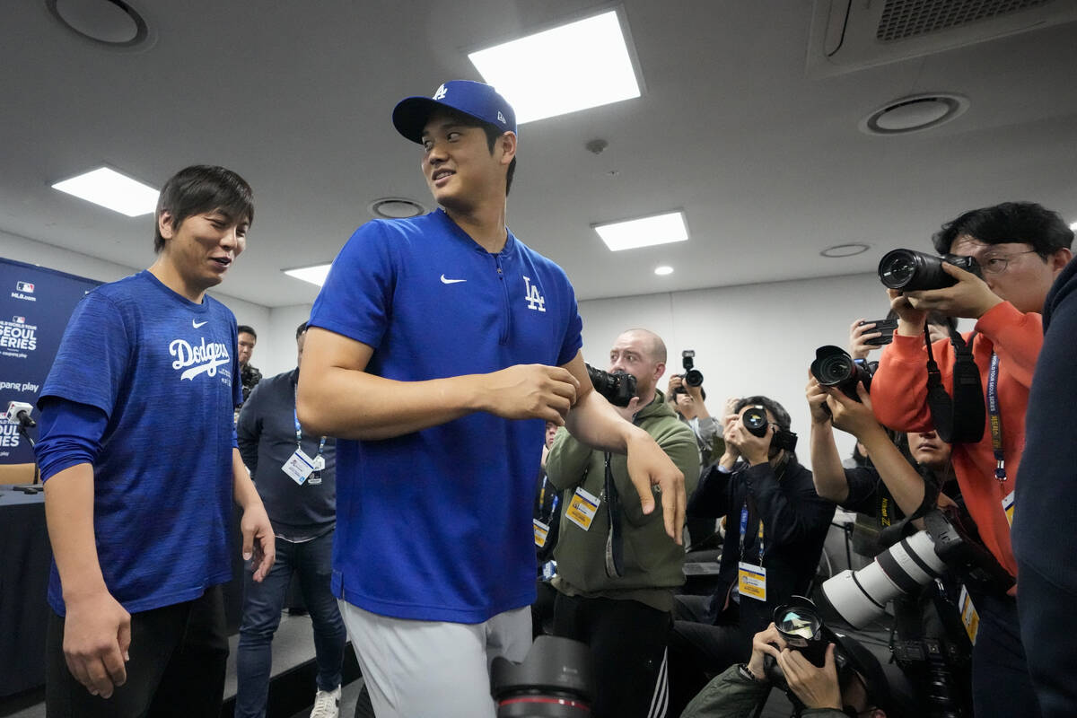 FILE - Los Angeles Dodgers' Shohei Ohtani, right, and his interpreter, Ippei Mizuhara, leave af ...