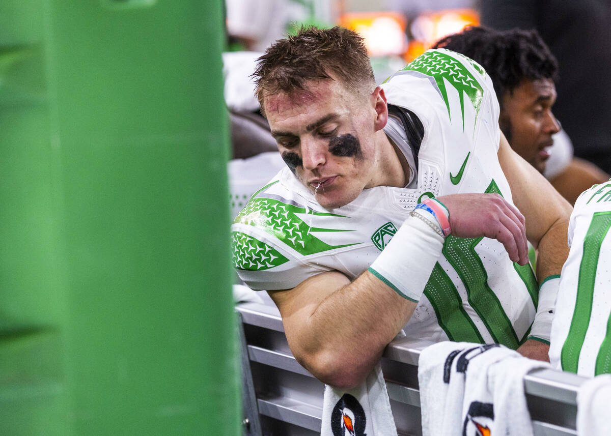 Oregon Ducks quarterback Bo Nix (10) spits on the bench against the Washington Huskies during t ...