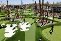 Workers put the finishing touches PopStroke mini-golf and entertainment facility at Town Square ...