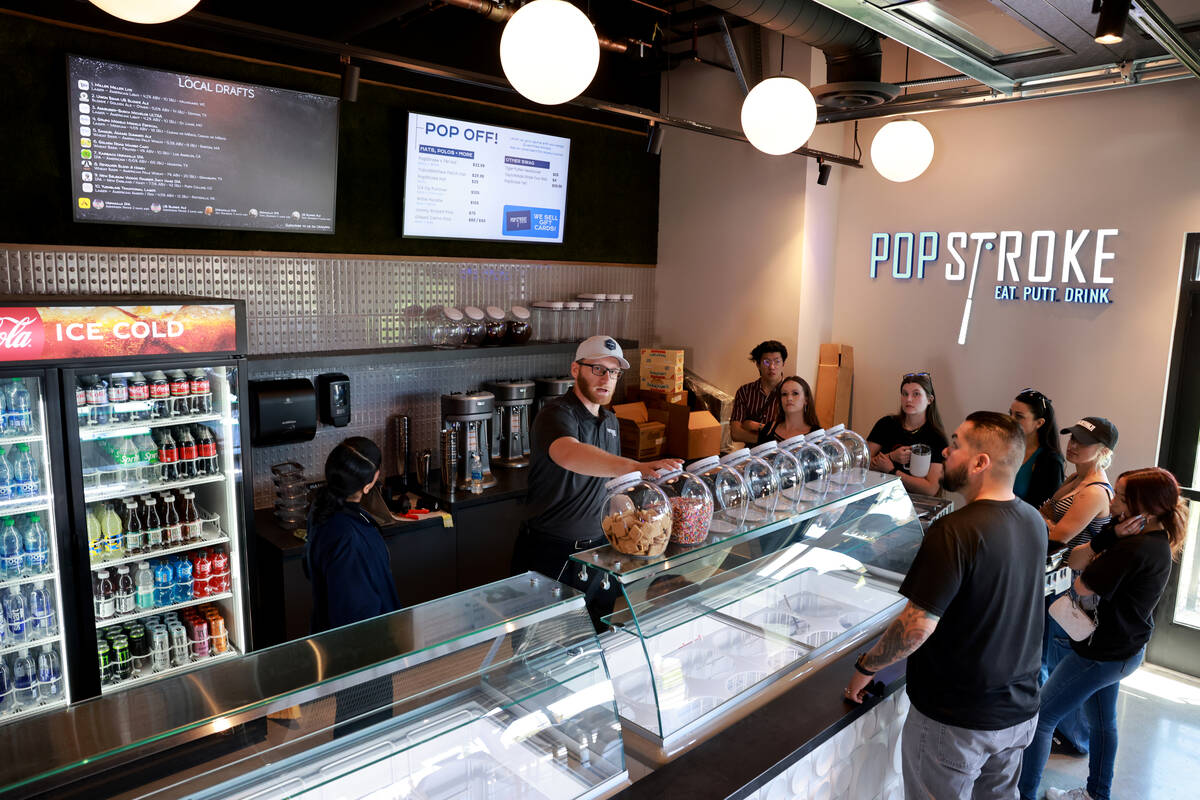 New employees get a tour of the ice cream parlor at PopStroke mini-golf and entertainment facil ...