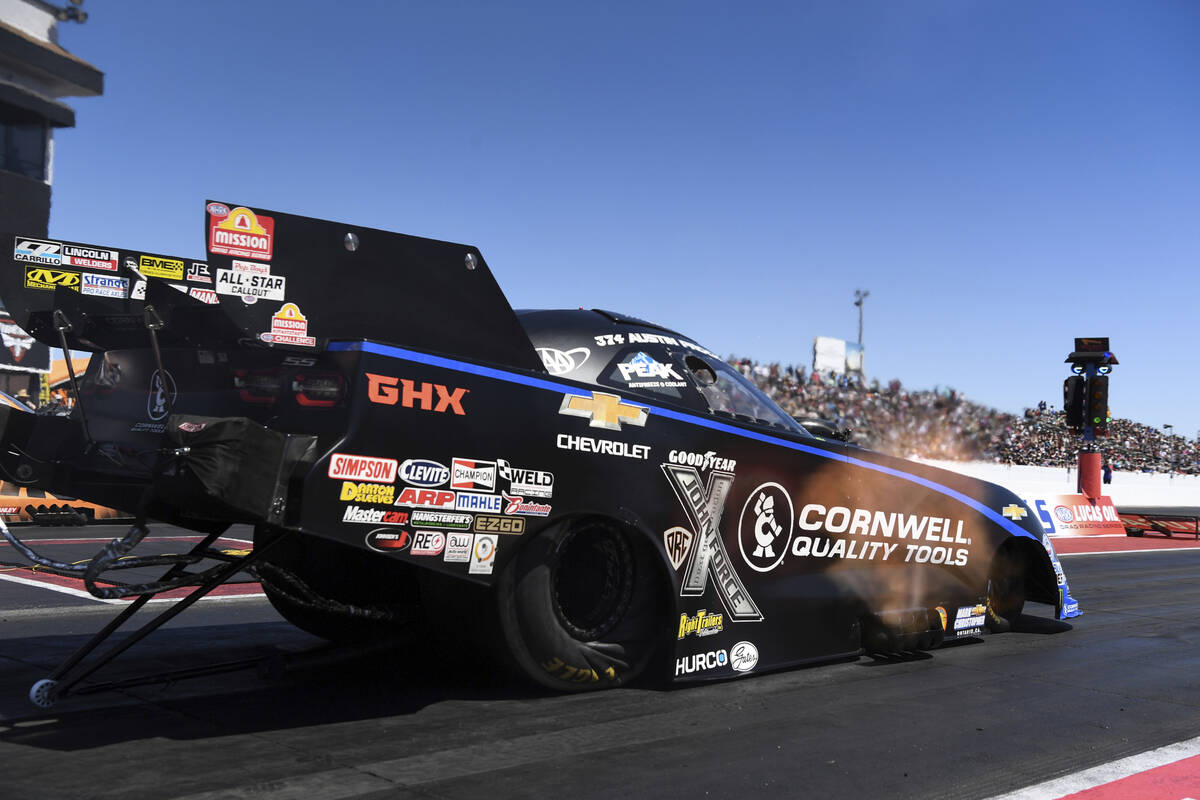 In this photo provided by the NHRA, Austin Prock drives in Funny Car finals at the NHRA Arizona ...