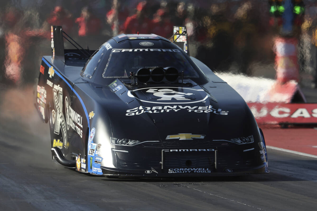 In this photo provided by the NHRA, Austin Prock competes in Funny Car qualifying during the NH ...