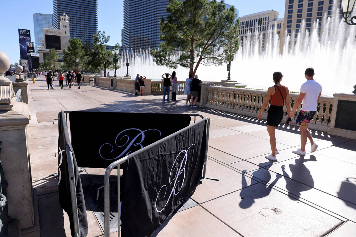 Barricades block off stumps from trees cut down in front of the Bellagio on the Strip in Las Ve ...