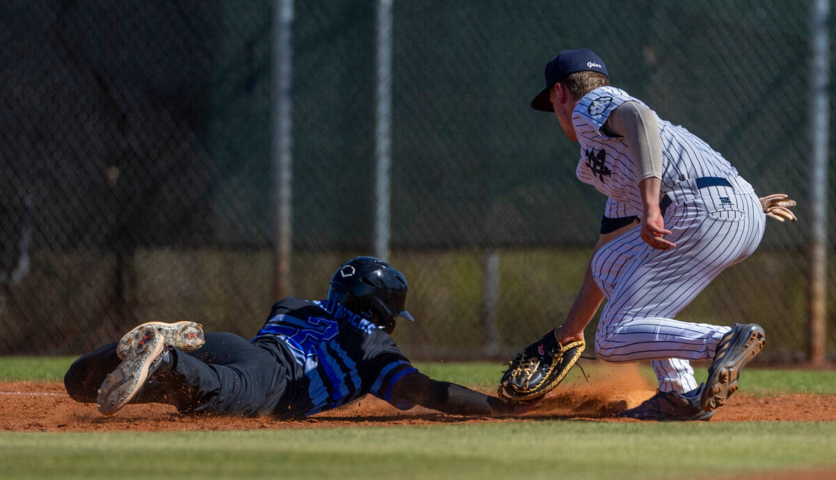 Basic runner Troy Southisene dives safely back to first base as Spring Valley infielder Jack Ri ...